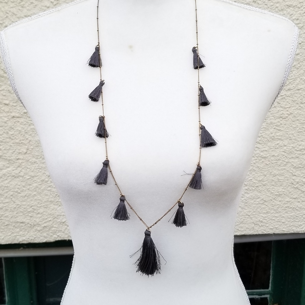 gold tone chain necklace with gray station tassels